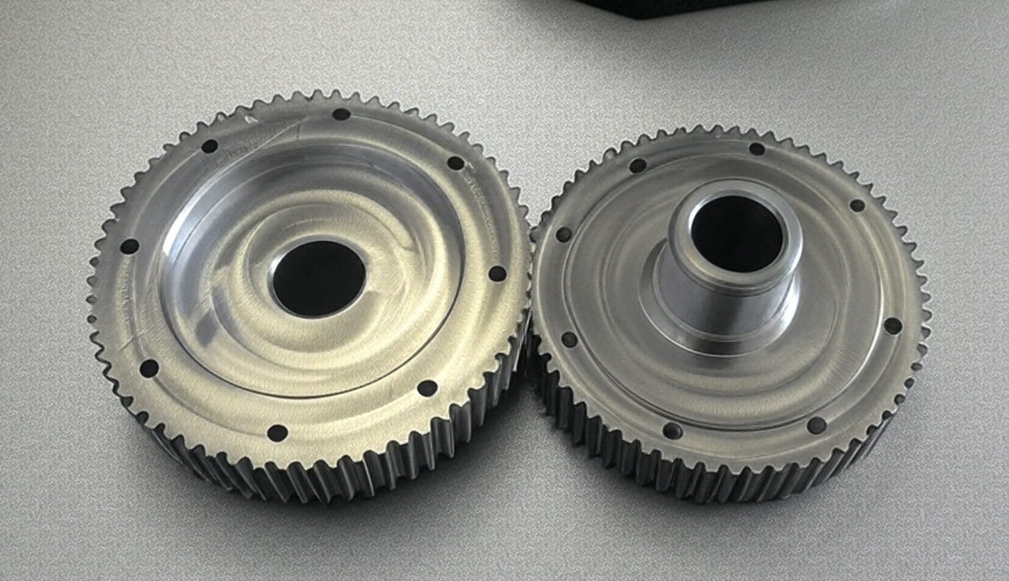 Two interlocking silver spur gears